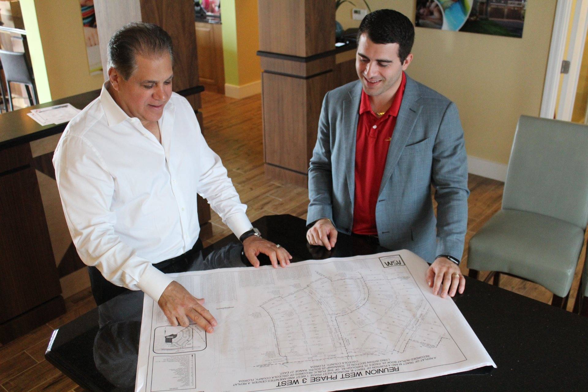 Art and Nick Falcone looking at a site plan