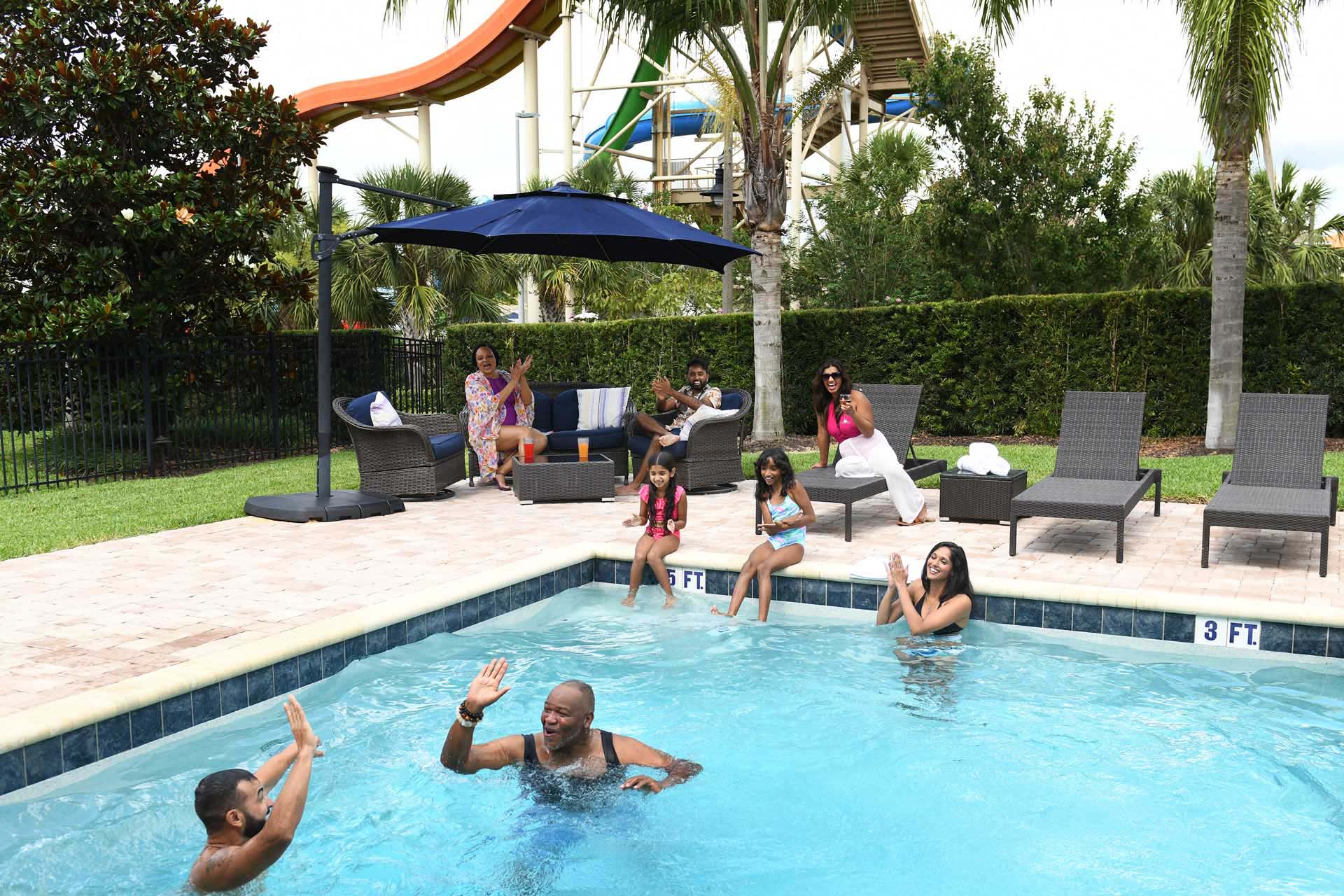 Family swimming in the pool of their Encore Resort home