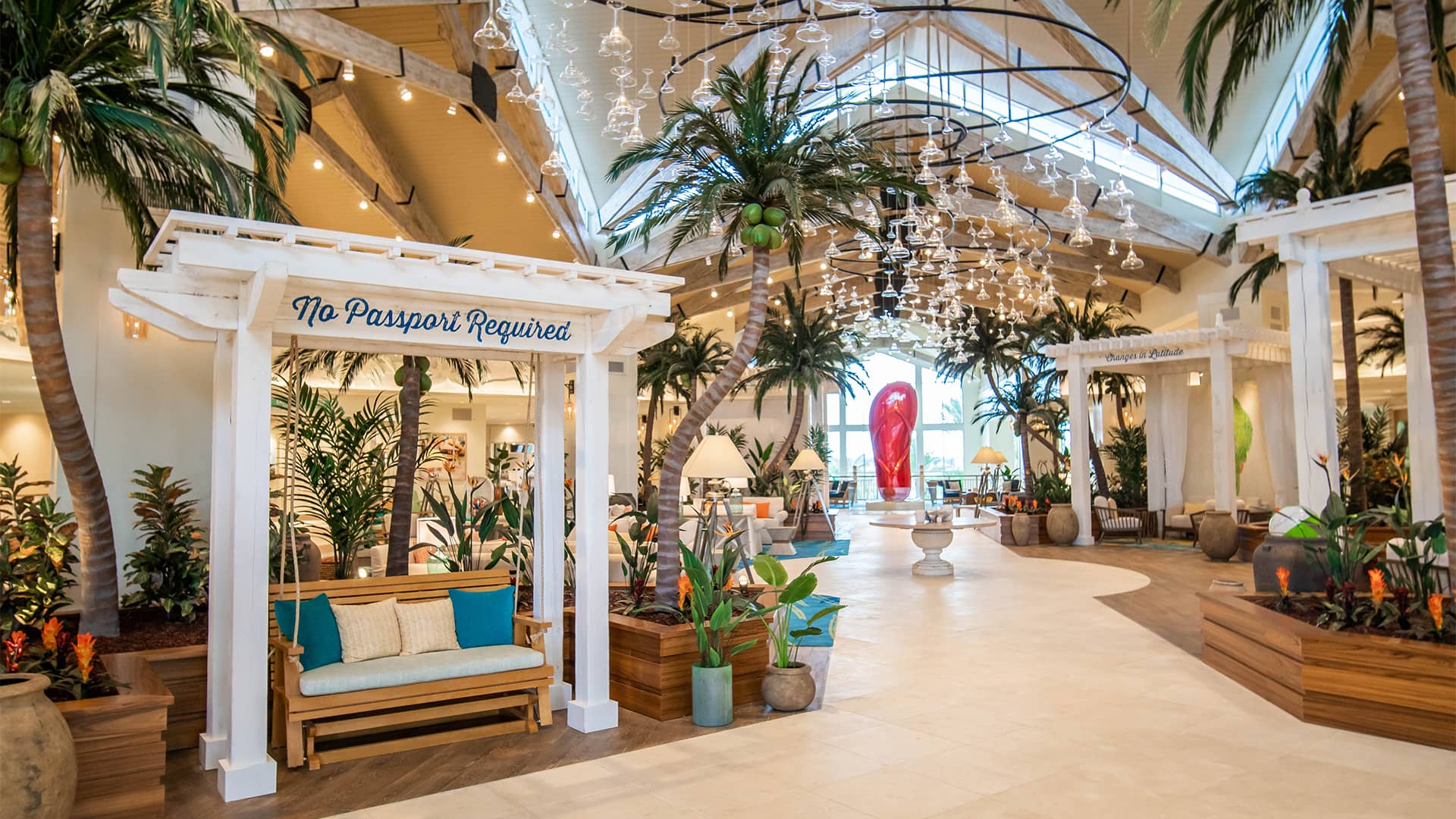 Margaritaville Resort Orlando lobby featuring a pergola with “No Passport Required“ painted along the top