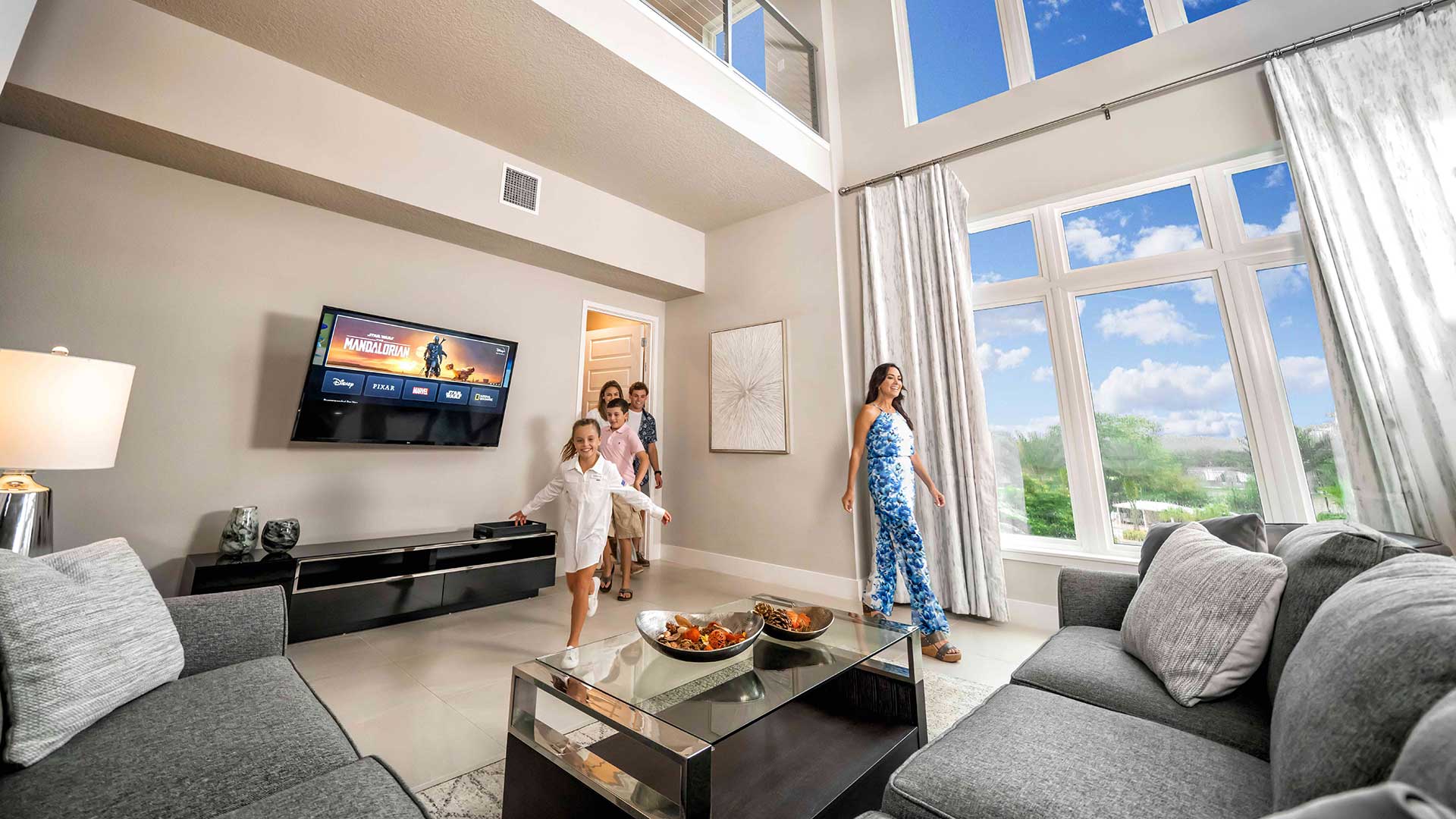 Family walking into and admiring their Spectrum Resort Orlando townhome
